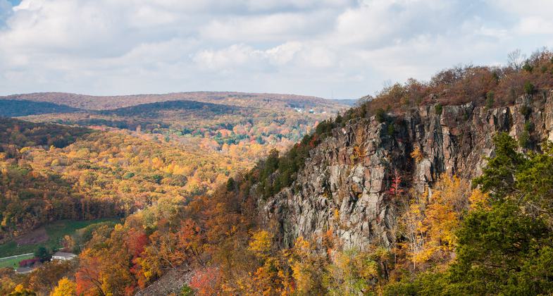 Sleeping Giant rises high above the woodlands of the surrounding valley. Photo by Justin Coleman.