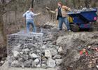 Building a rock gabion wall along the trail. Photo by Kansas DWPT.