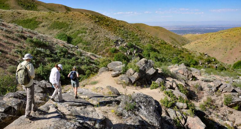 Hikers along the upper section of the Hulls Gulch Interpretive Trail. Photo by Larry Ridenhour.