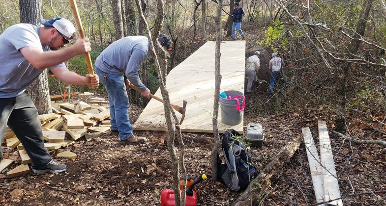 Nic Martinez and Nick Griffin Refuge Technicians remove some tripping hazards. Photo by FWNCR Staff.