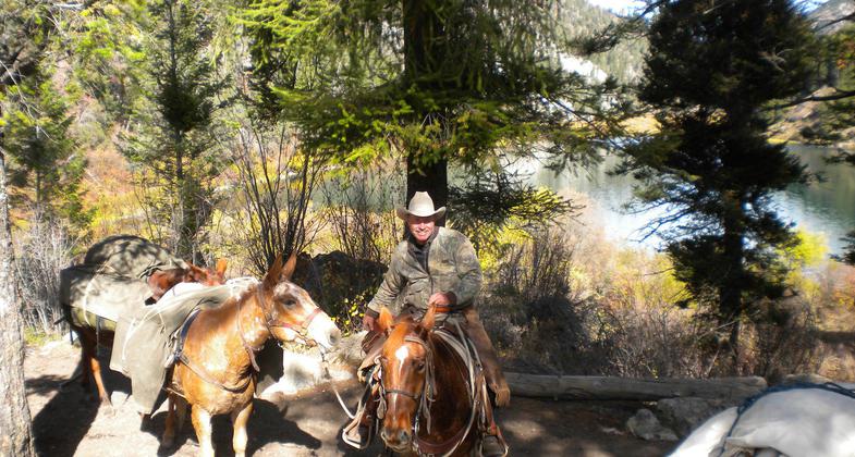 Back country guide and pack string near Palisades Lower Lake. Photo by USDA Forest Service Staff.