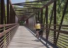The Poudre Trail has many miles of paved trails and sturdy bridges to ride your bike on along the Cache la Poudre River. Photo by Gabriele Woolever.