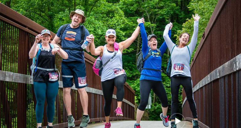 Participants of the 50K Ghost Town Trail Challenge leap for joy after completing 13 miles of the 32 mile run/hike challenge. Photo by Lance Harshbarger.