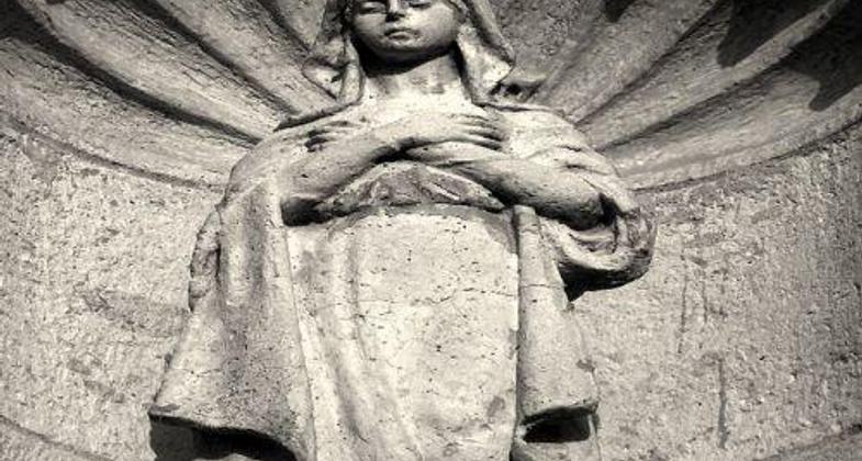 Mission Espiritu Santos: a carving on the stone wall in Goliad, Texas.