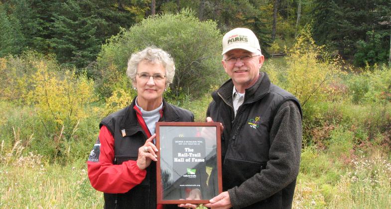 Harley Noem receives Certificate of Introduction to Rails-to-Trails Hall of Fame from Linda Mickelson Graham. Photo by Brooke Smith.
