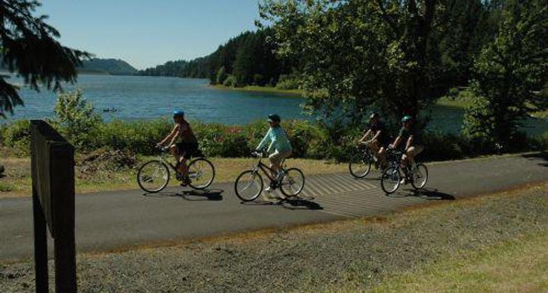 Bicyclists enjoying a ride around Dorena Reservoir along the Row River Trail.