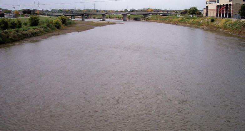 The Raccoon River inDes Moines, Iowa, as viewed upstream from a pedestrian bridge at its mouth at the Des Moines River. Photo by Tim Kiser.