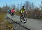 Bicyclists enoying spring sunshine on the Bird-to-Gird Trail near Anchorage. Photo by Susan Sommer.