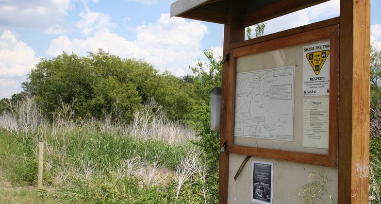 Trail entrance sign. Photo by Carl M. Smith.