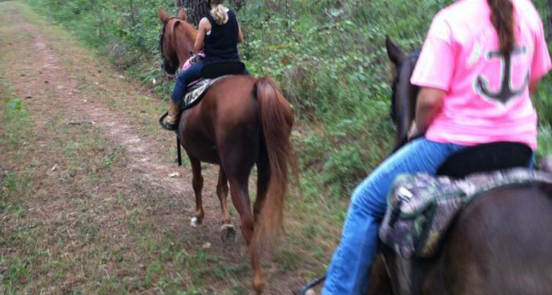 Young equestrians enjoying a ride on the trail. Photo by Donna Phillips.