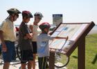 Bicyclist stop to view the Carlyle Lake Bike Trail. Photo by Bill Gruen