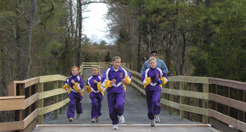 Cross country team practicing on the Junction and Breakwater Trail. Photo by Avery Dunn.