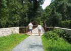 Walking over a pedestrian bridge on the Pomeroy and Newark Rail Trail. Photo by Avery Dunn.