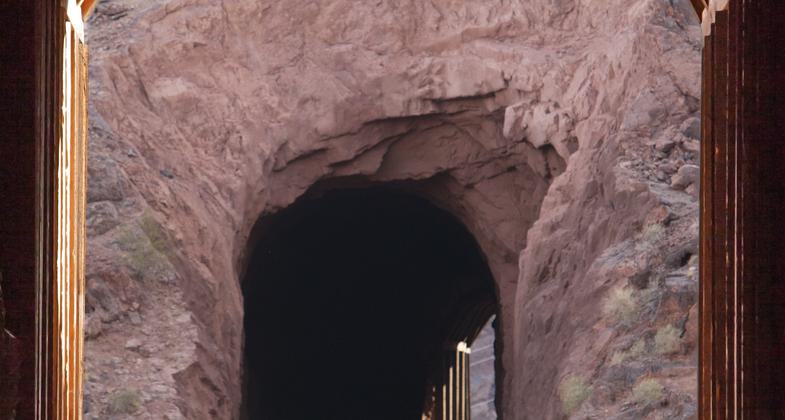 A couple pauses to enjoy a view of Lake Mead from the Historic Railroad Trail, Lake Mead NRA. Photo by Andrew Cattoir.