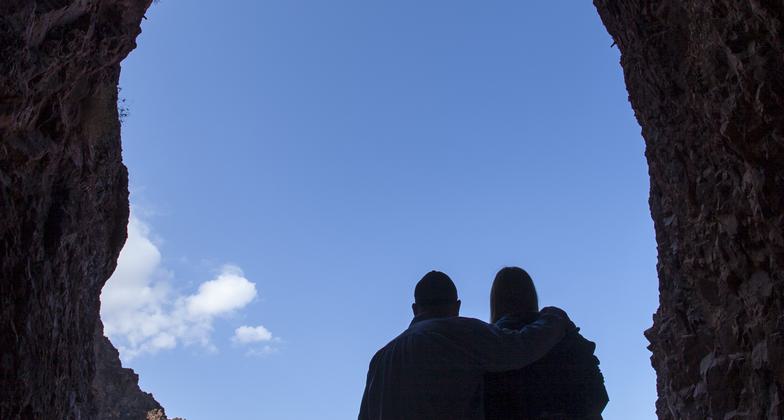 Visitor exits in a glow of light at the Historic Railroad Trail, Lake Mead NRA. Photo by Andrew Cattoir.