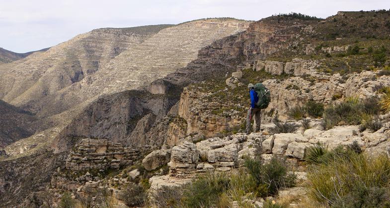 Hiker along McKittrick Canyon along the GRT.