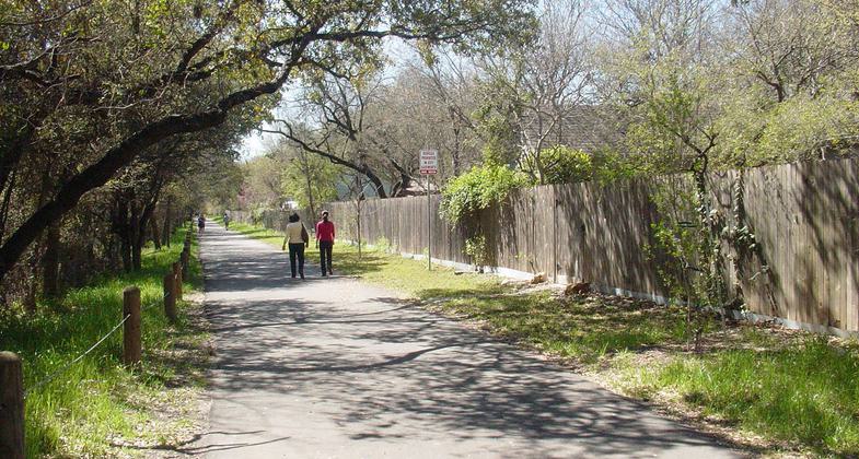People walking on the Salado Creek Greenway North near Voelcker Trailhead. Photo by Brandon Ross