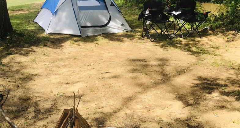 A Halloween decoration waving to hello trail users. It has reflectors in its eyes. Photo by Kristin Buchanan.