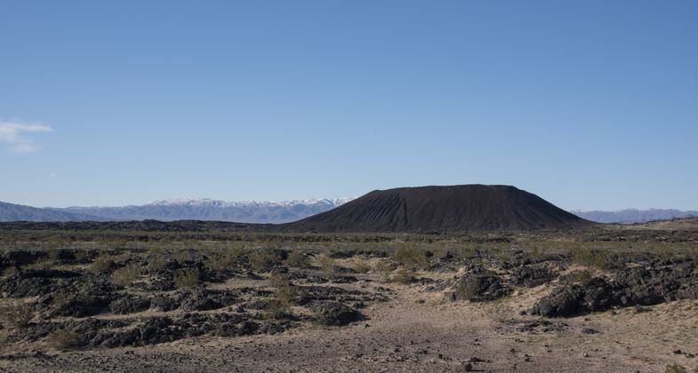 Photo by Kyle Sullivan. It's very uncommon, although not unheard of, to see snow at Amboy Crater.