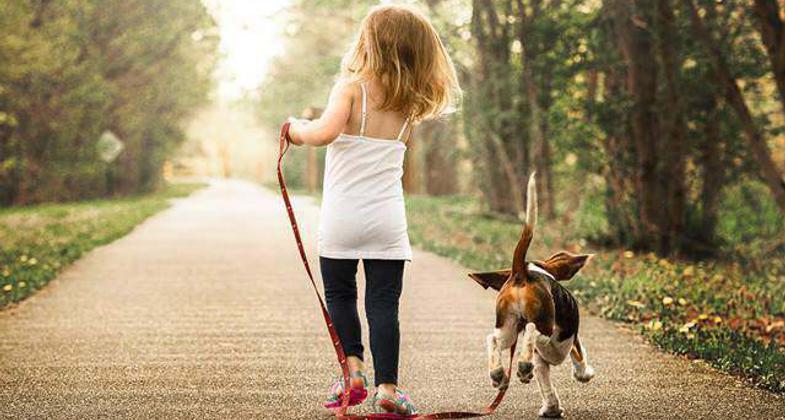 Child and Dog Walking the Great Guernsey Trail. Photo by Cassie Clarkson-Moyer
