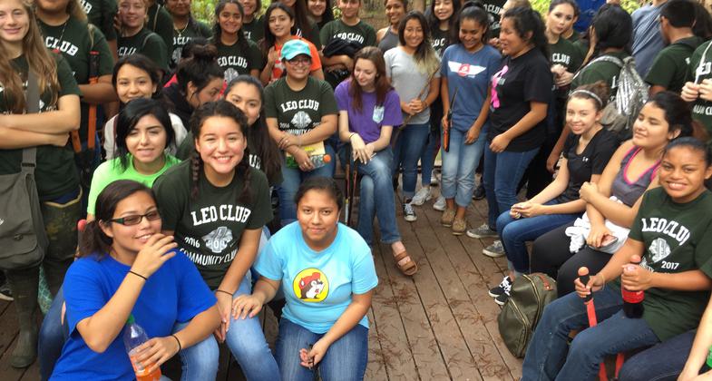 Leos Club of Liberty High School visiting the Palmer Bayou Boardwalk Observation Deck during a volunteer service field trip where they trimmed up the trail.