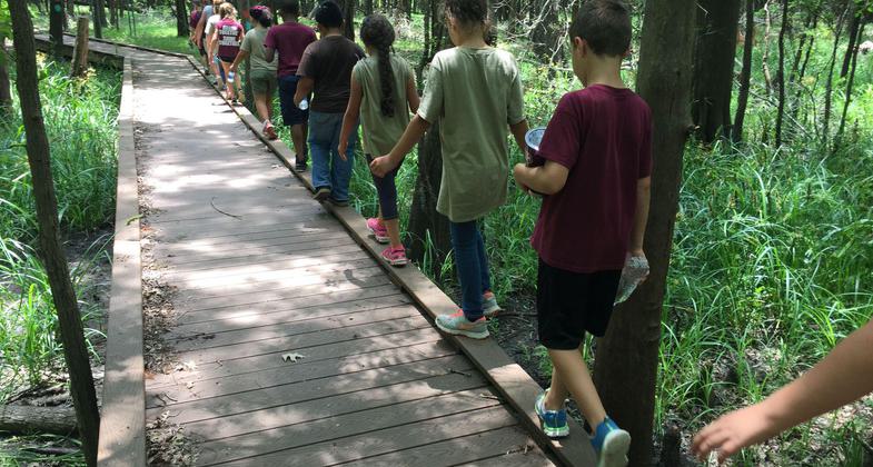 Playing 'Follow The Leader' on Knobby Knees Trail. Photo by Laurie Lomas Gonzales