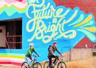 Cyclists enjoying the trail and public art. Photo by Springfield-Greene County Parks
