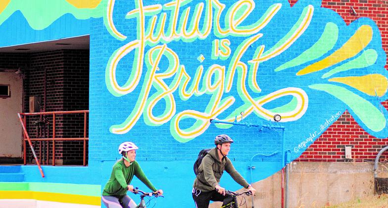 Cyclists enjoying the trail and public art. Photo by Springfield-Greene County Parks
