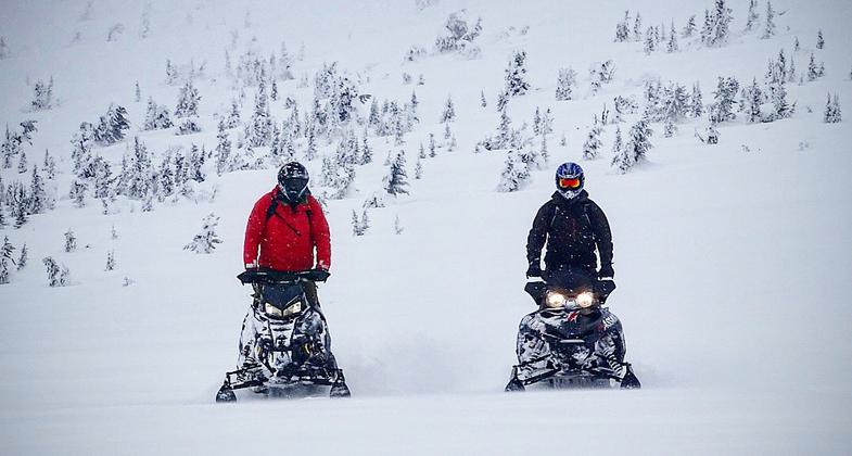Snowmobilers enjoying fresh snow. Photo by Allyson Orange.