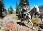 Big Jim, of the Backcountry Horseman, and his dog, Millie, both on their way to bring tools and supplies up to the crew. Photo by Liam Downs-Tepper.