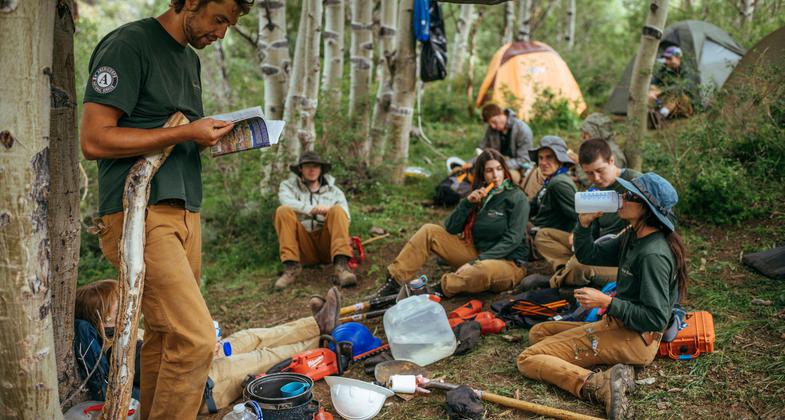 Crew lead Amos Frye teaching fellow Nevada Conservation Corps youths about the Great Basin. Photo by Ken Etzel.