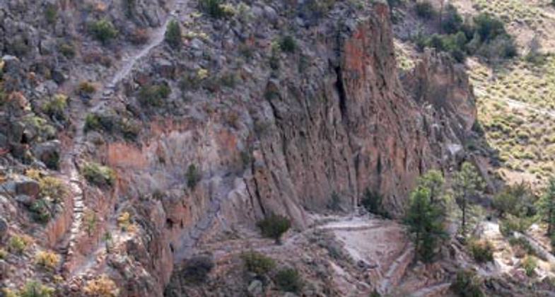 Frijolito Loop Trail passes through the Pinon-Juniper woodland and offers expansive views of the surrounding area. Photo by Sally King courtesy NPS.