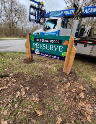 Installation of new sign at California Woods. Photo by Cincinnati Park Board.
