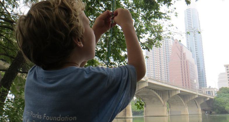 Young anglers along the Ann and Roy Butler Hike and Bike Trail on Ladybird Lake just south of downtown Austin, Texas. Photo by Chris Sheffield.
