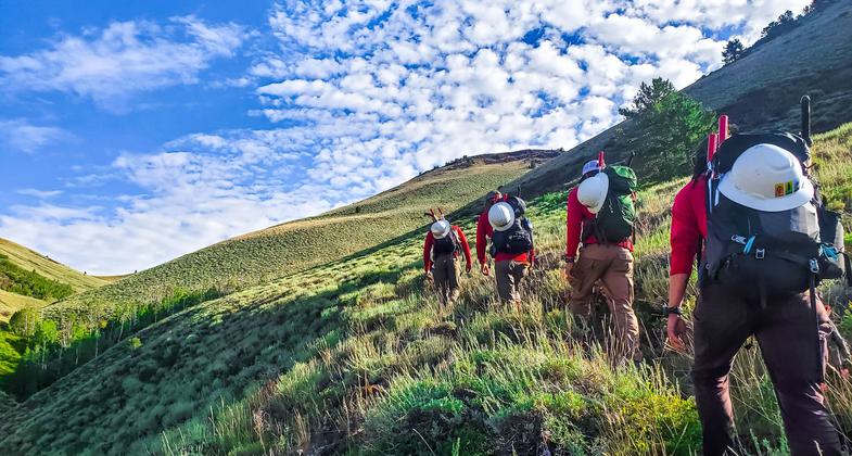 Trail Crew hiking to their work site along the TCT.